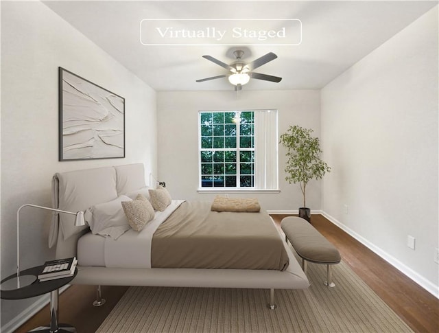 200 Renaissance Pkwy NE Unit 302, Atlanta, GA 30308 - bedroom with wood finished floors, baseboards, and ceiling fan