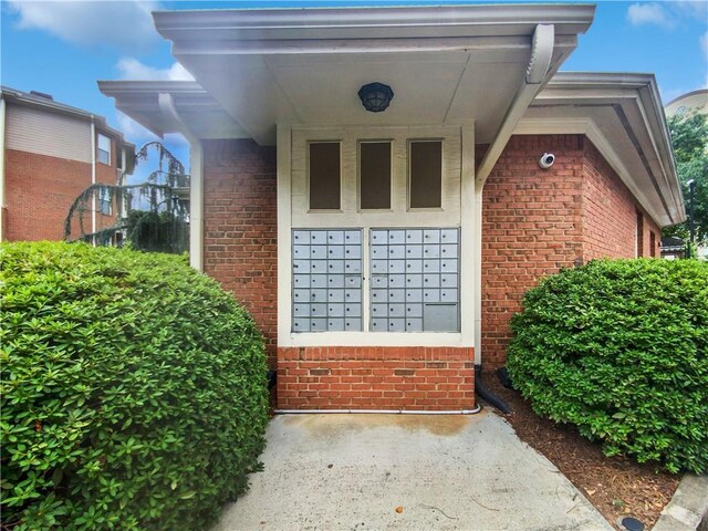 200 Renaissance Pkwy NE Unit 302, Atlanta, GA 30308 - doorway to property with brick siding