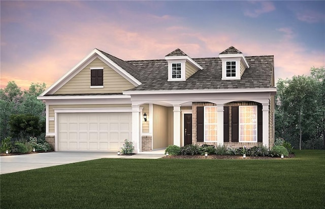 view of front of property featuring a front lawn, concrete driveway, and a garage