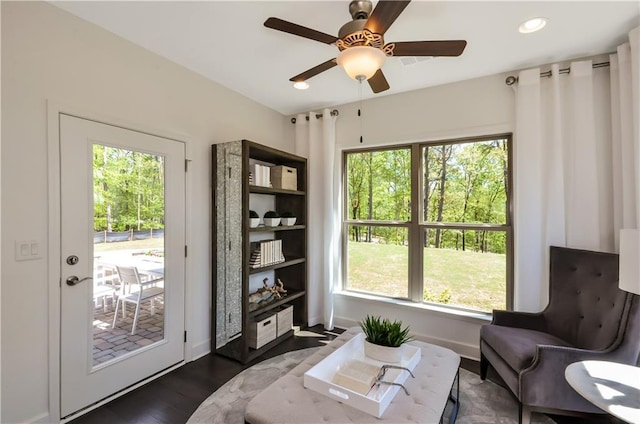 sitting room featuring ceiling fan, dark wood-type flooring, recessed lighting, and baseboards
