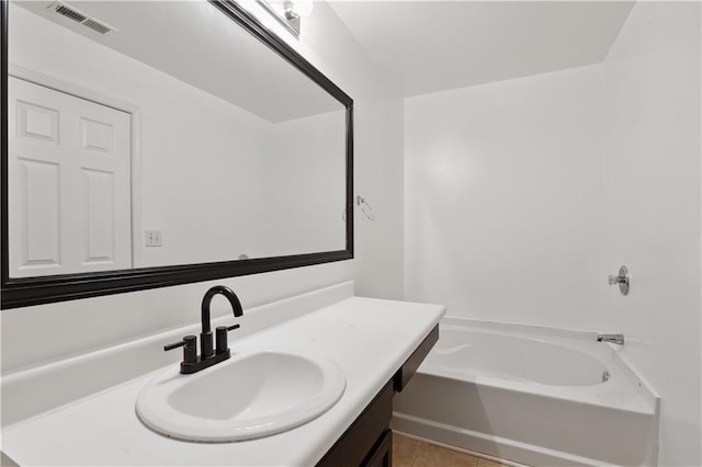 full bathroom featuring vanity, tile patterned floors, and shower / washtub combination