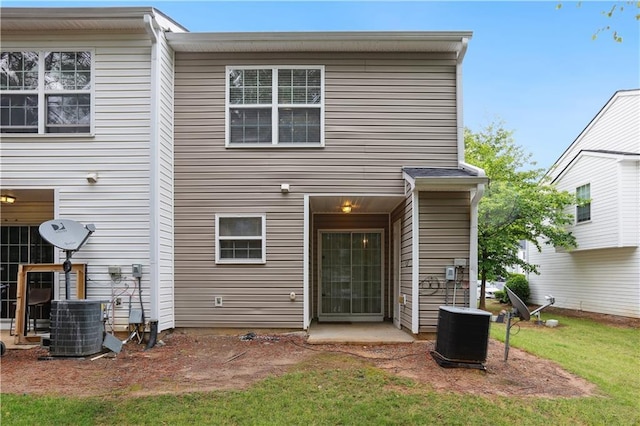 rear view of house with cooling unit