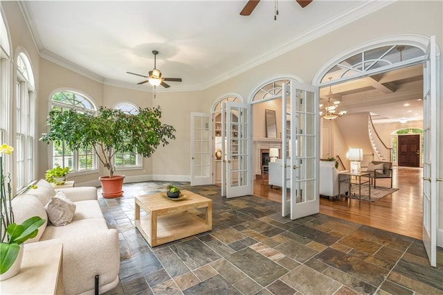 1655 Arrowhead Trl NE, Atlanta, GA 30345 - living area with a ceiling fan, french doors, crown molding, baseboards, and stone tile floors