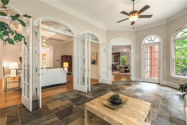 1655 Arrowhead Trl NE, Atlanta, GA 30345 - foyer featuring french doors, stone tile floors, ornamental molding, and healthy amount of natural light