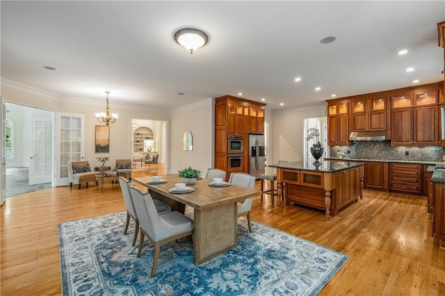 1655 Arrowhead Trl NE, Atlanta, GA 30345 - dining room with light wood-type flooring, a chandelier, ornamental molding, and recessed lighting