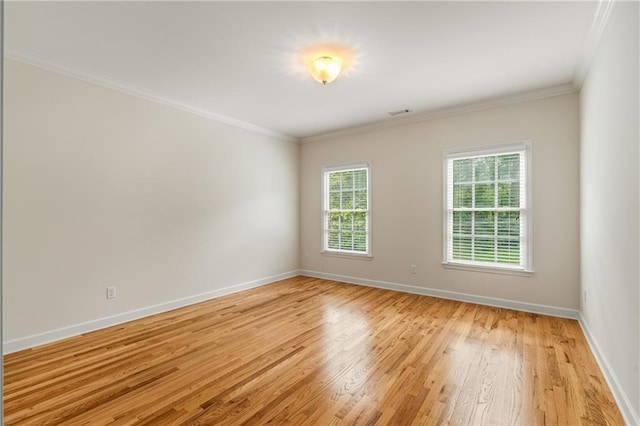 1655 Arrowhead Trl NE, Atlanta, GA 30345 - spare room featuring light wood-style flooring, baseboards, and ornamental molding
