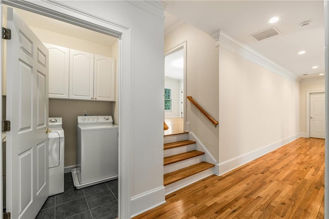 1655 Arrowhead Trl NE, Atlanta, GA 30345 - laundry area featuring independent washer and dryer, cabinet space, crown molding, baseboards, and recessed lighting