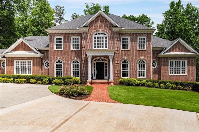 1655 Arrowhead Trl NE, Atlanta, GA 30345 - colonial house featuring brick siding and a front lawn