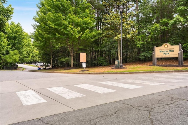 1655 Arrowhead Trl NE, Atlanta, GA 30345 - view of asphalt street featuring curbs, street lighting, and view of scattered trees