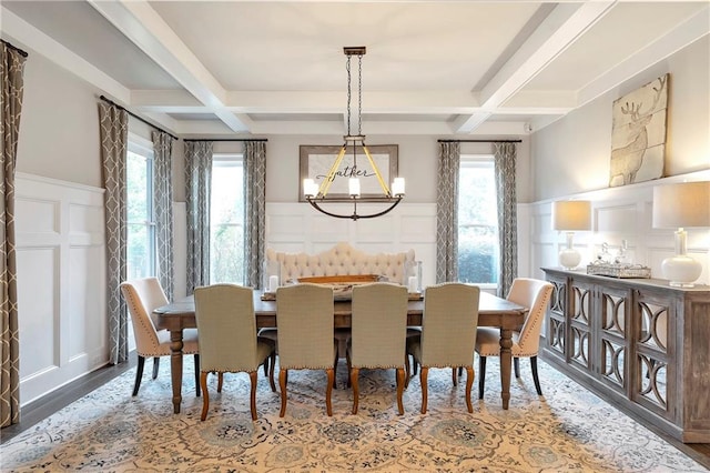 dining area with plenty of natural light, coffered ceiling, and beamed ceiling