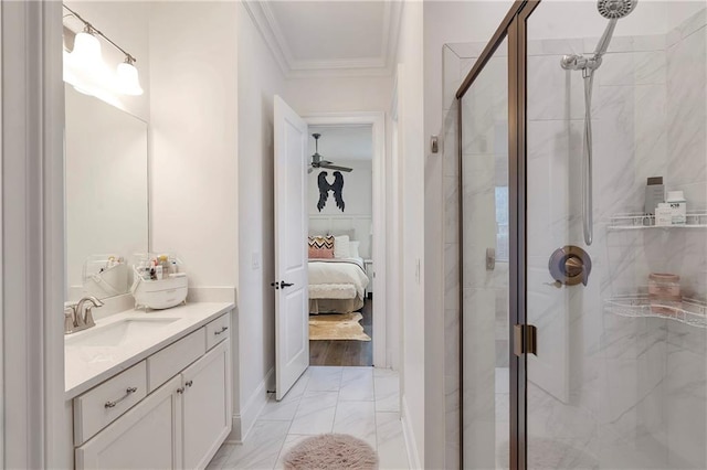 bathroom with vanity, ornamental molding, and a shower with shower door