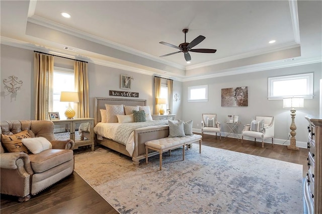 bedroom with ceiling fan, multiple windows, dark hardwood / wood-style flooring, and ornamental molding