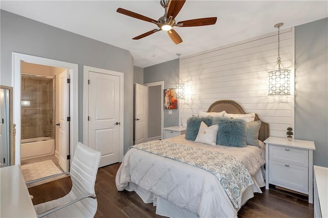 bedroom featuring ensuite bathroom, ceiling fan, and dark hardwood / wood-style flooring