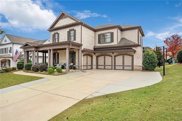 view of front of house featuring a garage and a front yard