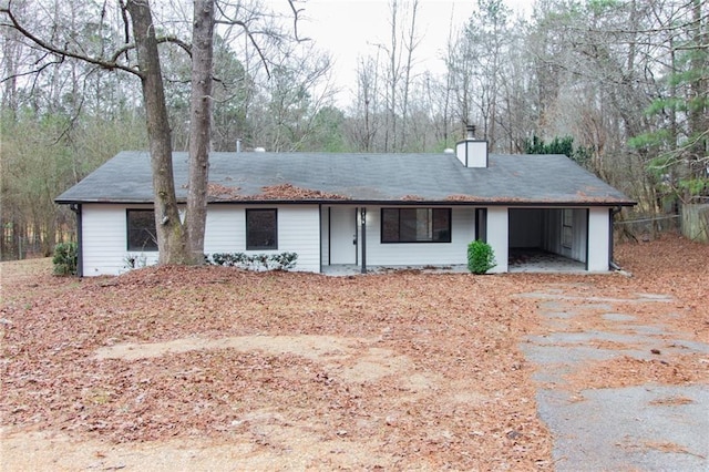 ranch-style house with a chimney