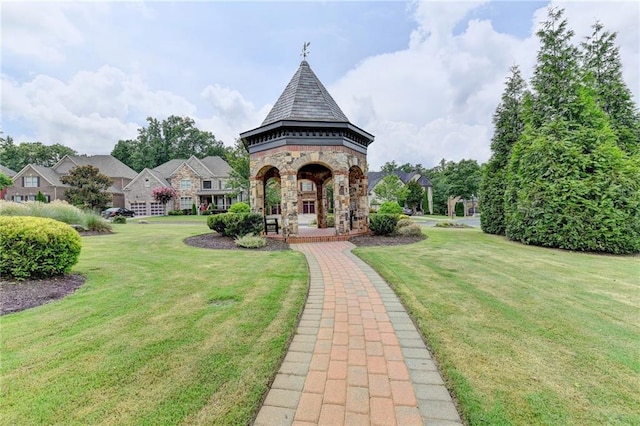 view of home's community with a gazebo and a lawn