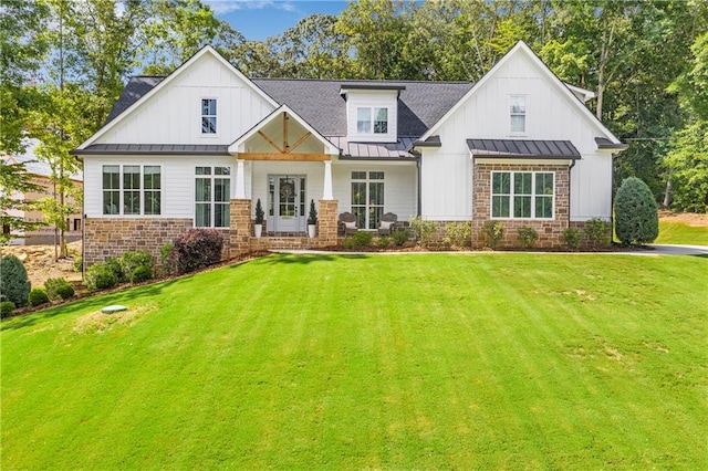 modern inspired farmhouse with a front yard