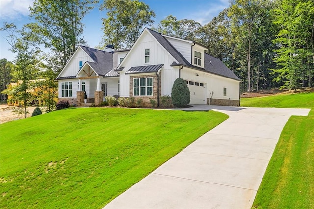 view of front facade with a front yard and a garage