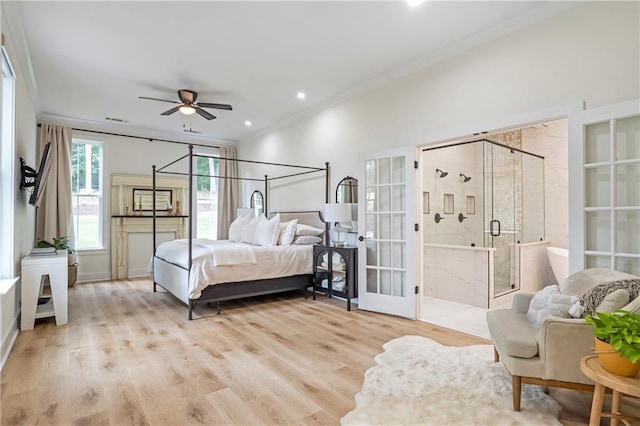 bedroom featuring ceiling fan, crown molding, ensuite bathroom, and light hardwood / wood-style floors