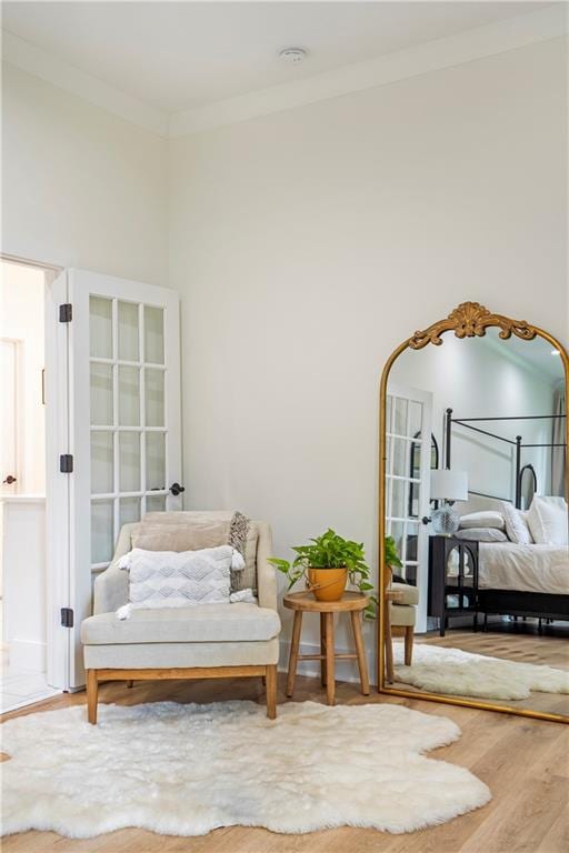 interior space with ornamental molding and wood-type flooring