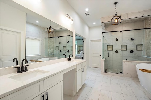 bathroom featuring vanity and shower with separate bathtub