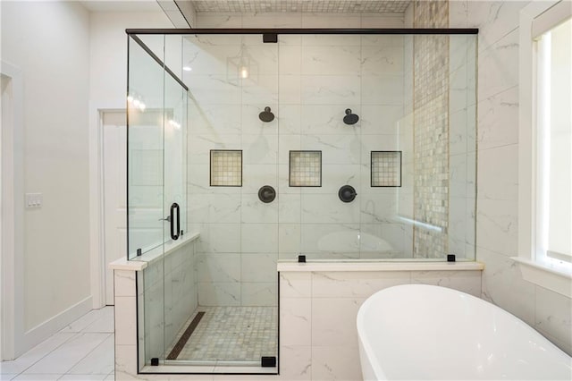 bathroom featuring shower with separate bathtub