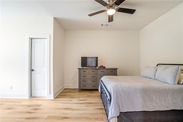 bedroom with light wood-type flooring and ceiling fan