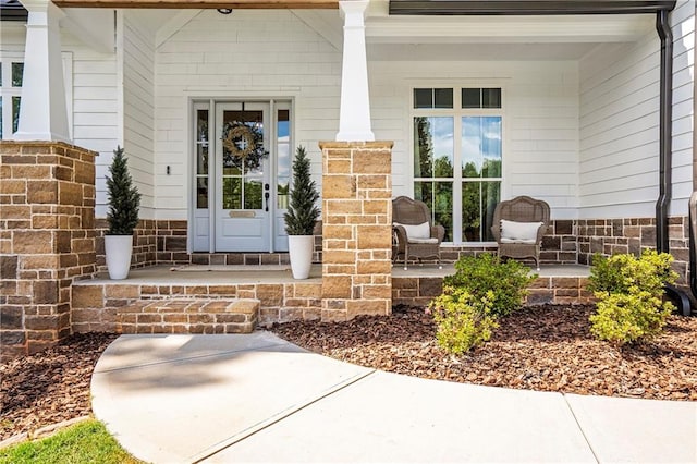 doorway to property featuring covered porch