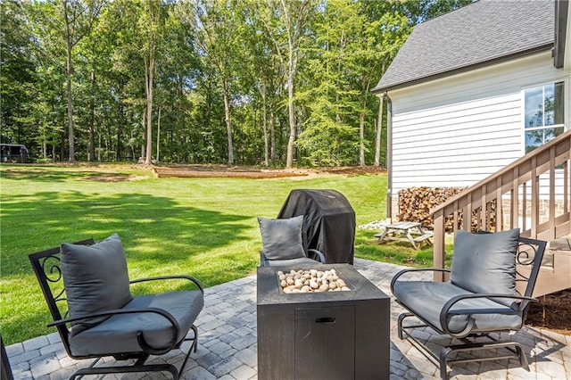 view of patio with a fire pit