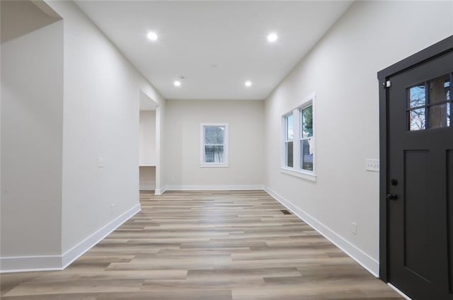 entrance foyer with recessed lighting, baseboards, and light wood-style floors