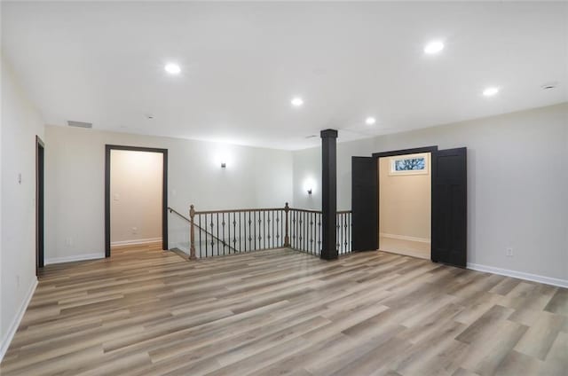 spare room with recessed lighting, visible vents, baseboards, and light wood-style flooring