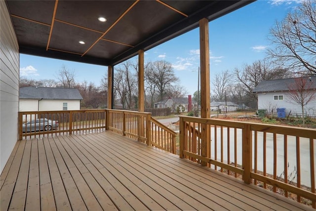 wooden deck with a residential view