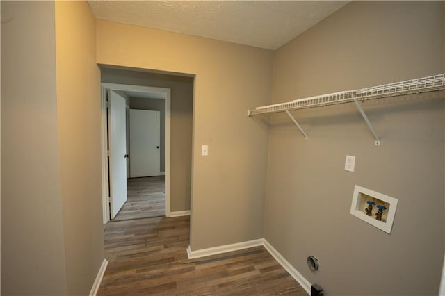 laundry room featuring laundry area, baseboards, dark wood finished floors, a textured ceiling, and washer hookup