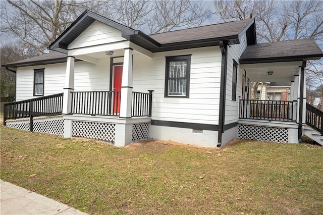 bungalow-style home featuring covered porch, a front lawn, crawl space, and a shingled roof