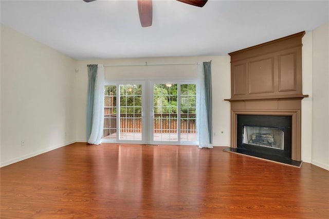 3443 Lathenview Ct, Alpharetta, GA 30004 - unfurnished living room with a ceiling fan, wood finished floors, and a large fireplace
