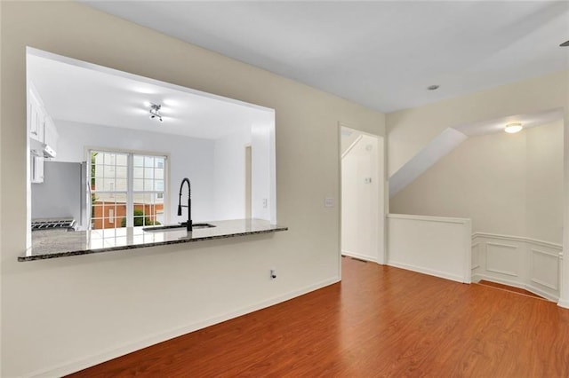3443 Lathenview Ct, Alpharetta, GA 30004 - unfurnished living room featuring a sink and wood finished floors