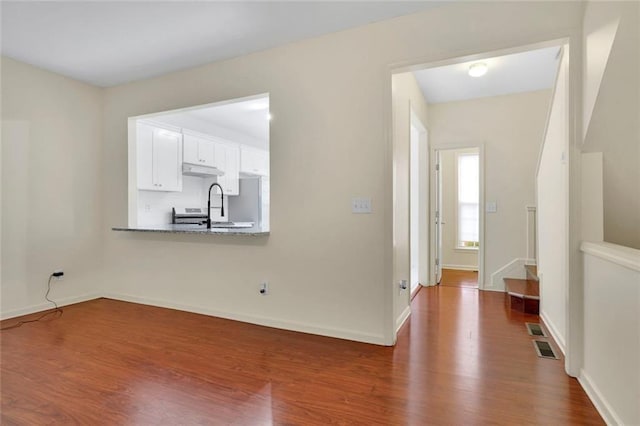 3443 Lathenview Ct, Alpharetta, GA 30004 - spare room featuring dark wood-type flooring and baseboards
