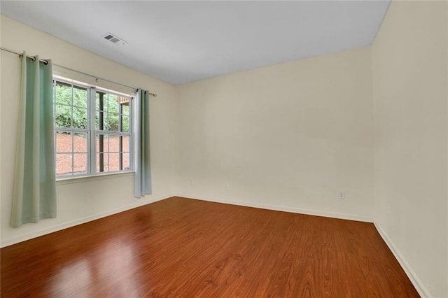 3443 Lathenview Ct, Alpharetta, GA 30004 - empty room with wood finished floors and baseboards