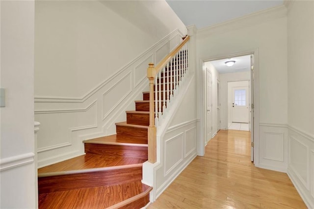 3443 Lathenview Ct, Alpharetta, GA 30004 - stairs featuring a decorative wall, wood finished floors, crown molding, and a wainscoted wall