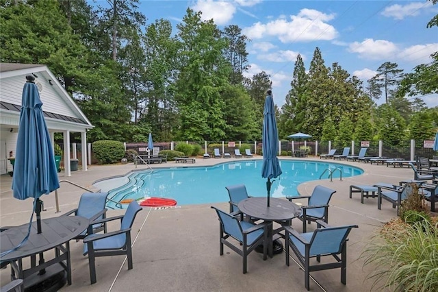 3443 Lathenview Ct, Alpharetta, GA 30004 - community pool featuring a patio and view of wooded area