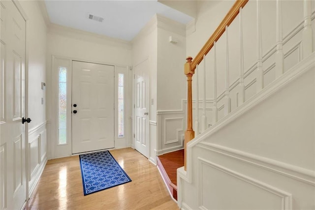 3443 Lathenview Ct, Alpharetta, GA 30004 - entryway featuring a decorative wall, stairway, light wood-type flooring, and ornamental molding