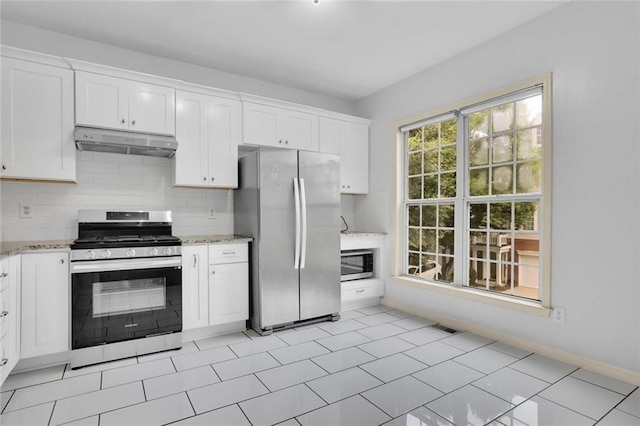 3443 Lathenview Ct, Alpharetta, GA 30004 - kitchen featuring stainless steel appliances, under cabinet range hood, light stone counters, and white cabinetry