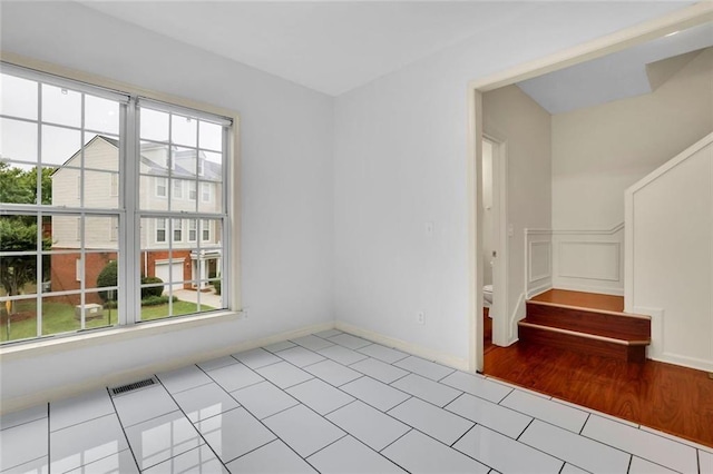3443 Lathenview Ct, Alpharetta, GA 30004 - empty room with healthy amount of natural light and tile patterned floors