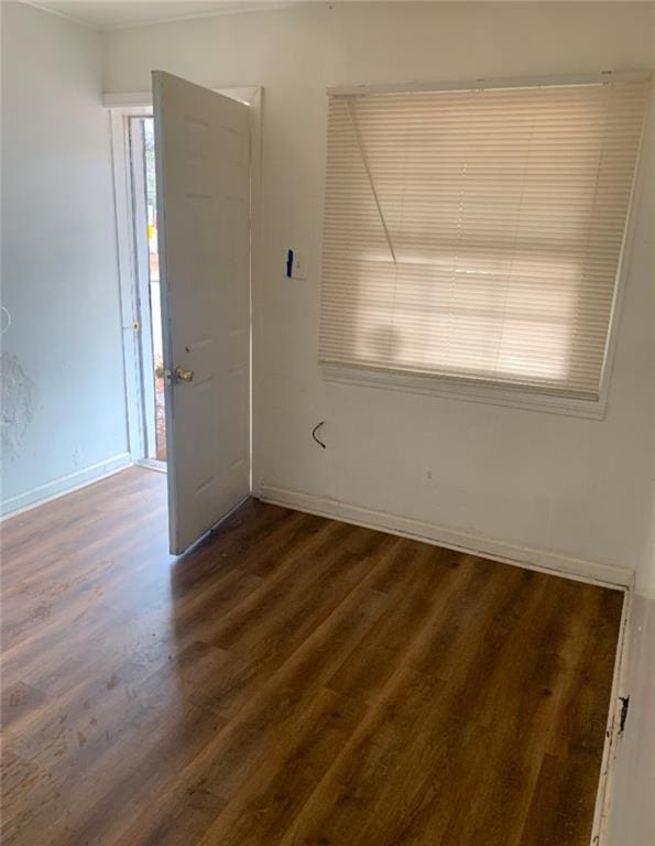 empty room featuring dark hardwood / wood-style floors