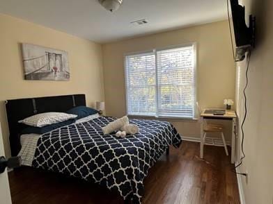 737 Cooper St SW, Atlanta, GA 30315 - bedroom with baseboards and wood finished floors
