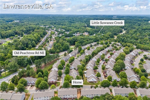 bird's eye view with a residential view and a wooded view