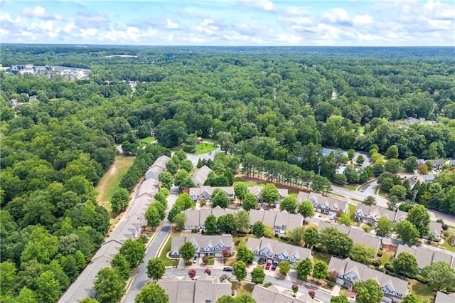 bird's eye view with a residential view and a wooded view