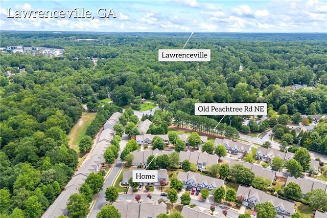 aerial view featuring a residential view and a wooded view