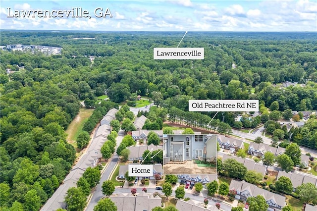 bird's eye view featuring a forest view