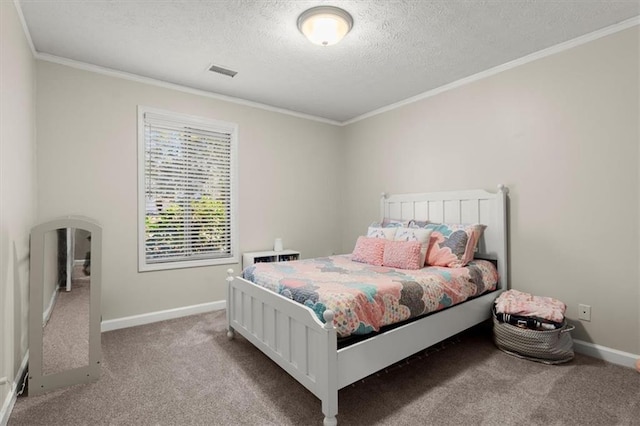 carpeted bedroom with ornamental molding and a textured ceiling